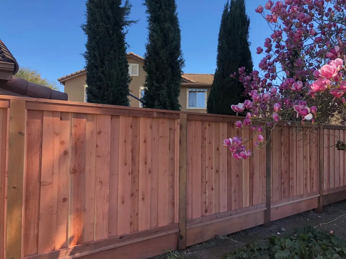 Redwood fence with cap and trim